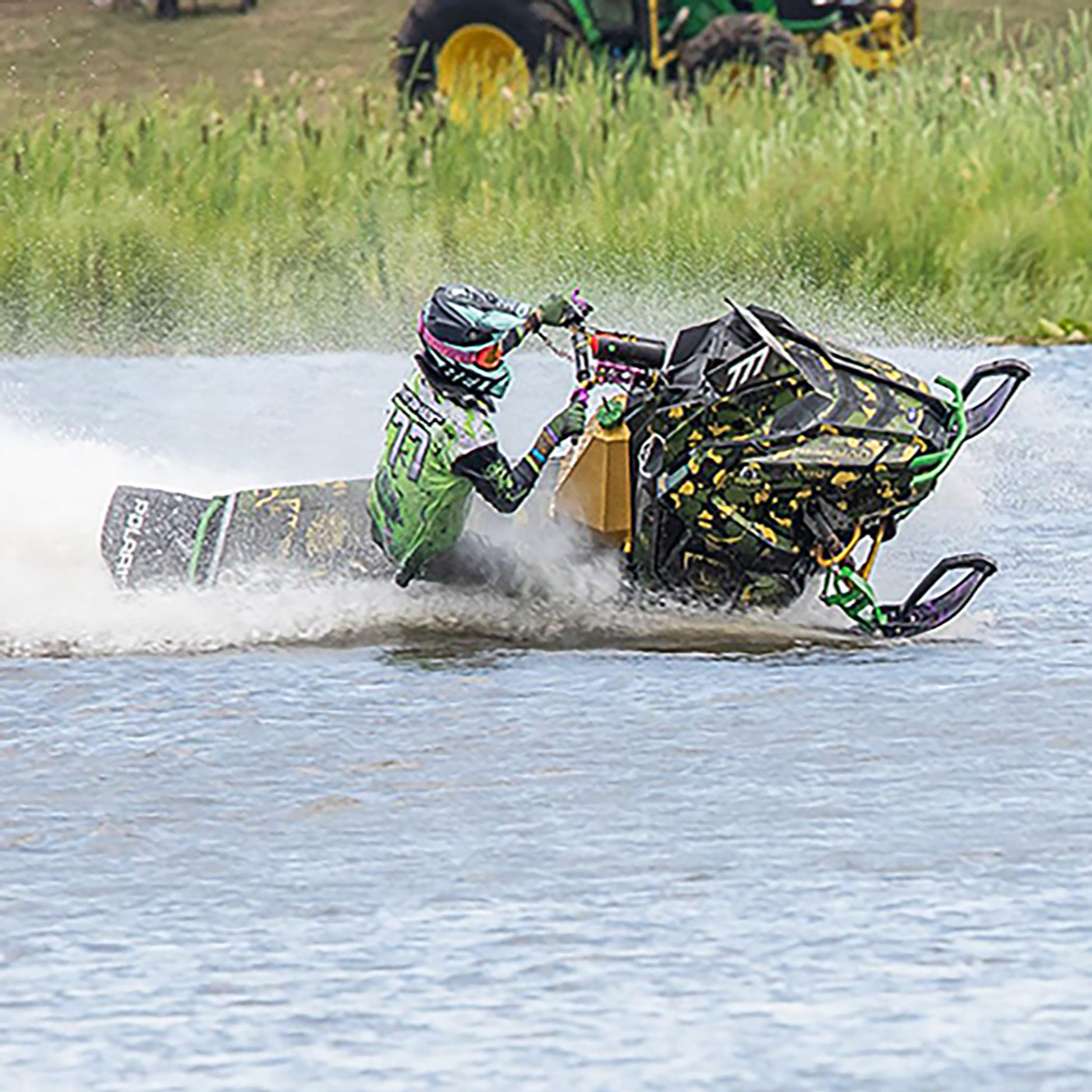 Grant Whitaker racing at an IWA race with custom purple and black C&A Pro skis with black handles