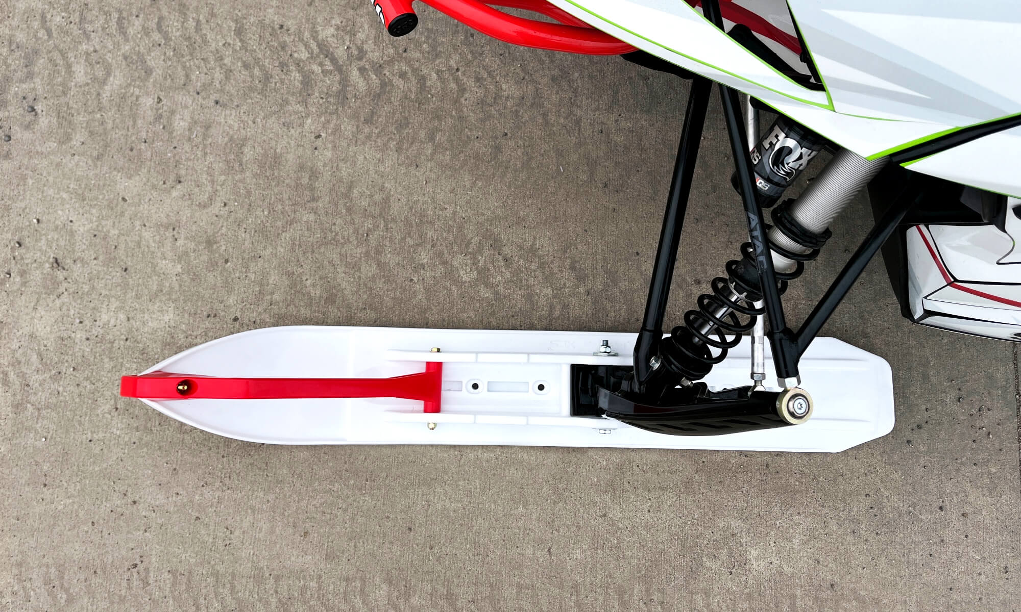 White C&A Pro XCS ski with red handle installed on Arctic Cat snowmobile