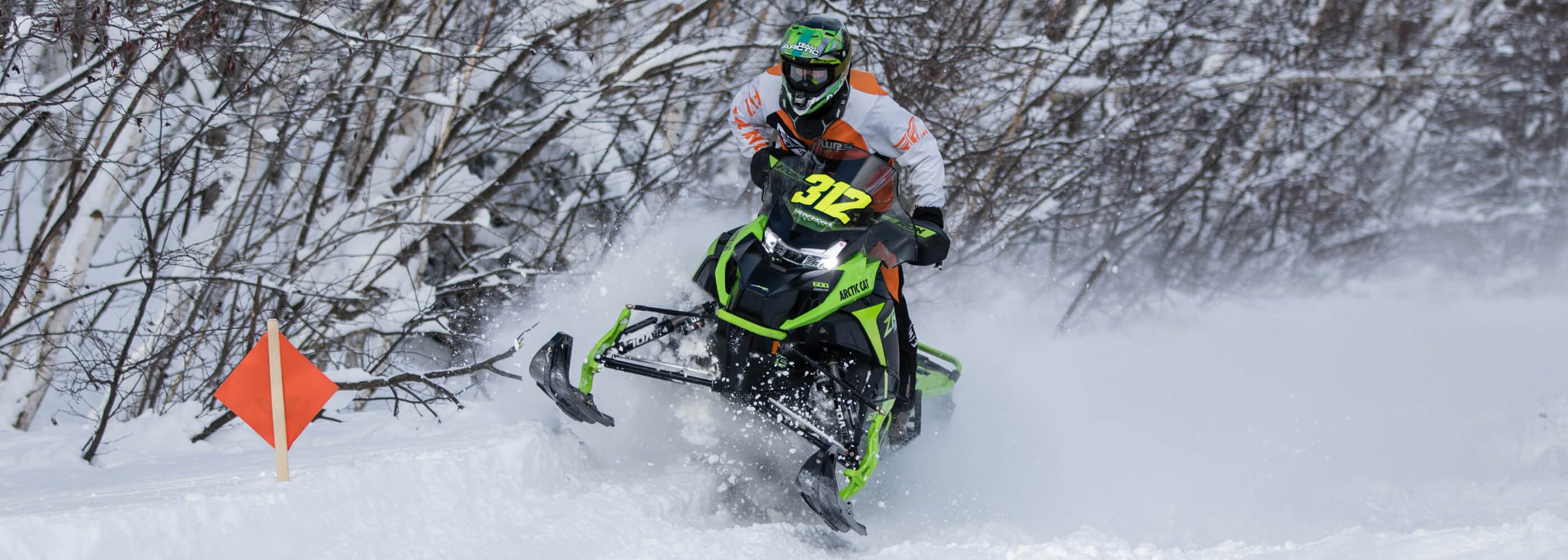 Professional cross country racer Zach Herfindahl on Arctic Cat snowmobile with C&A Pro black XCS skis