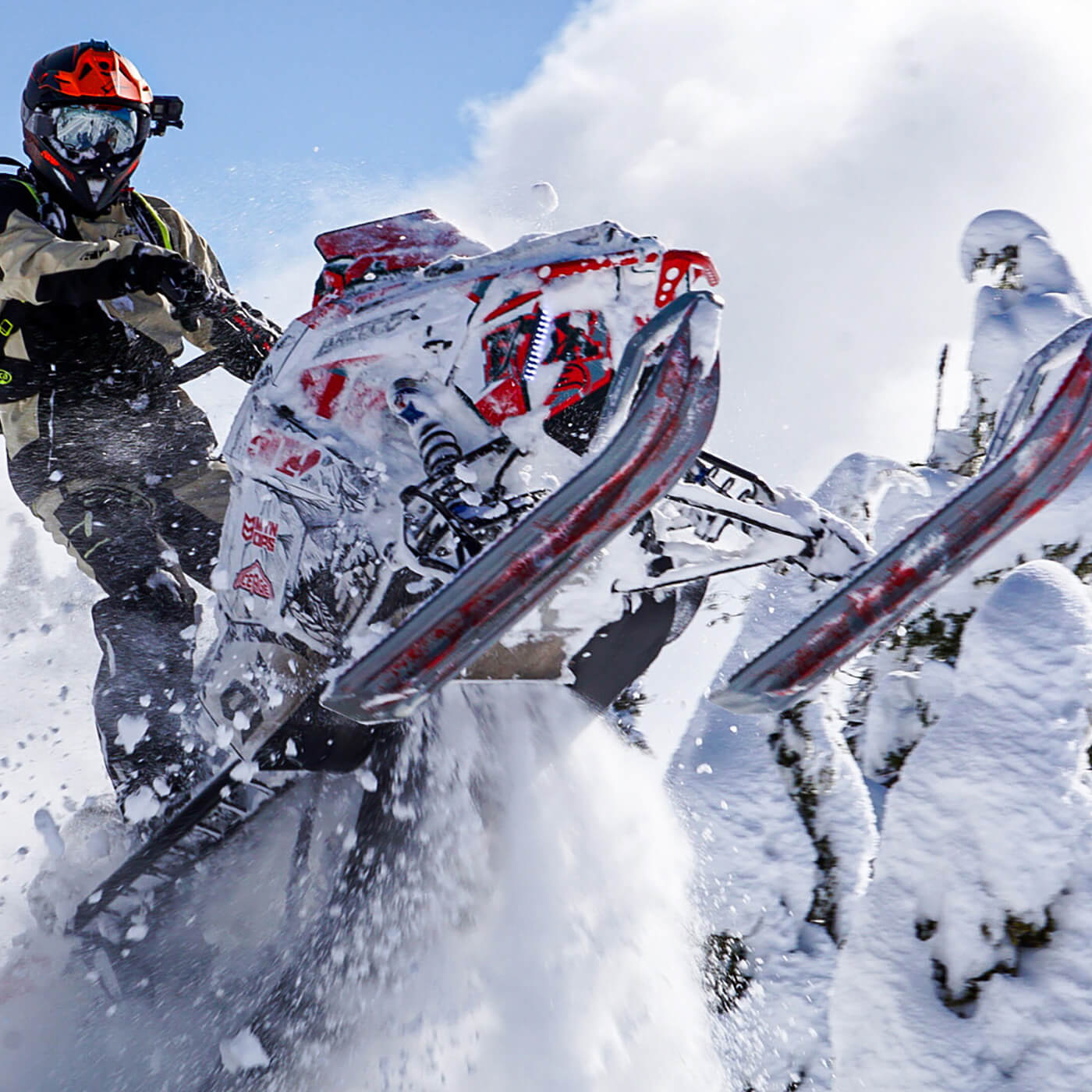 Emmett Melton backcountry racing on custom red and grey C&A Pro skis with grey handles