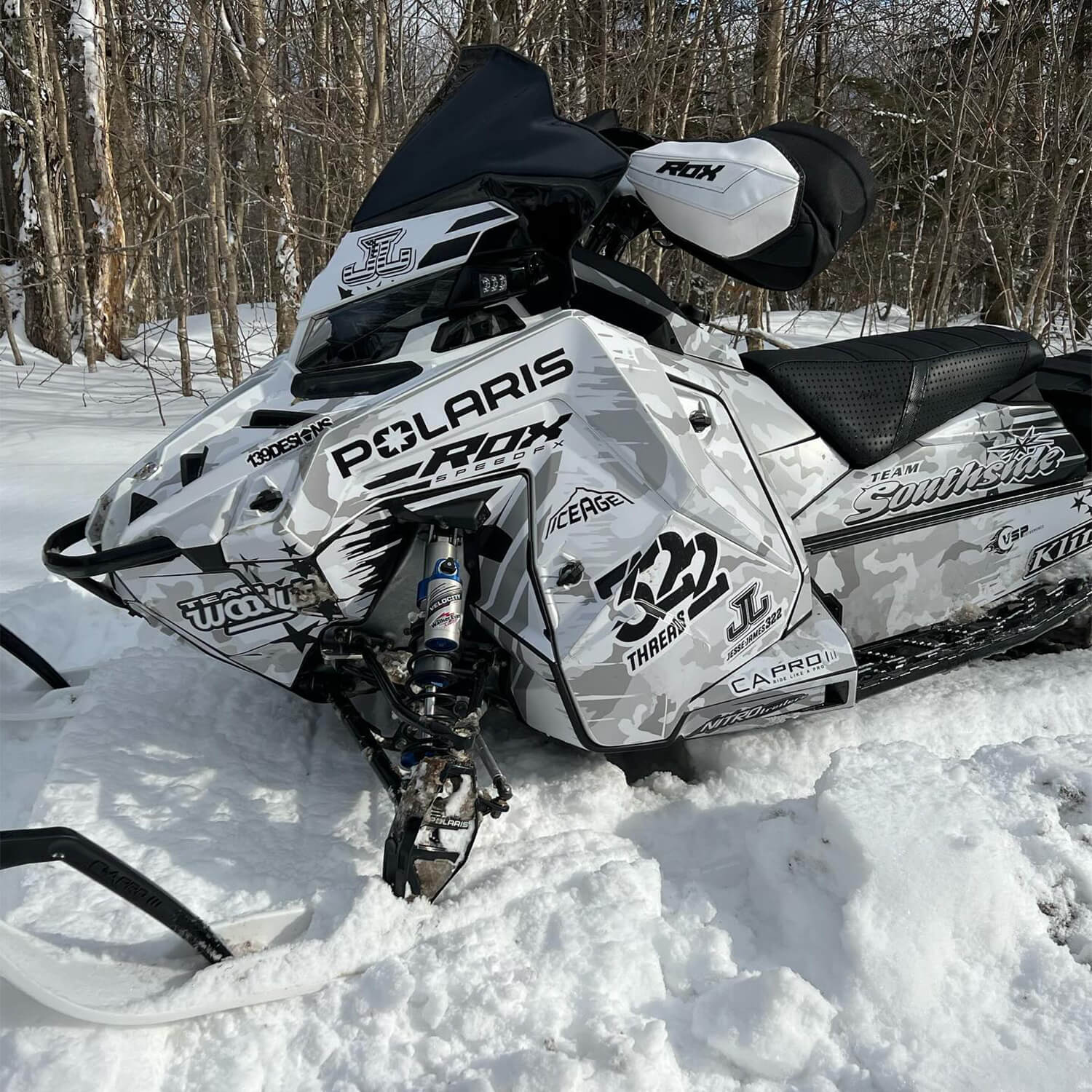 Jesse James Bonaduce #332 Polaris sled with black and white wrap and white C&A Pro Skis