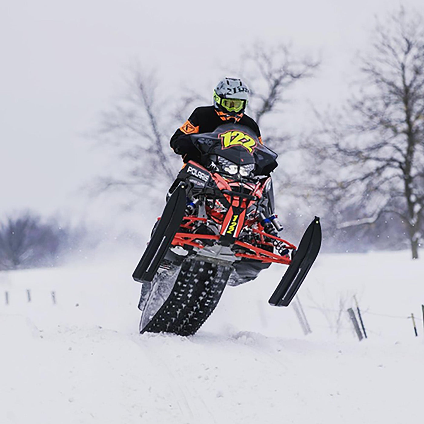 Professional cross country snowmobile race team member Alex Hetteen sledding with all-black C&A Pro skis. 