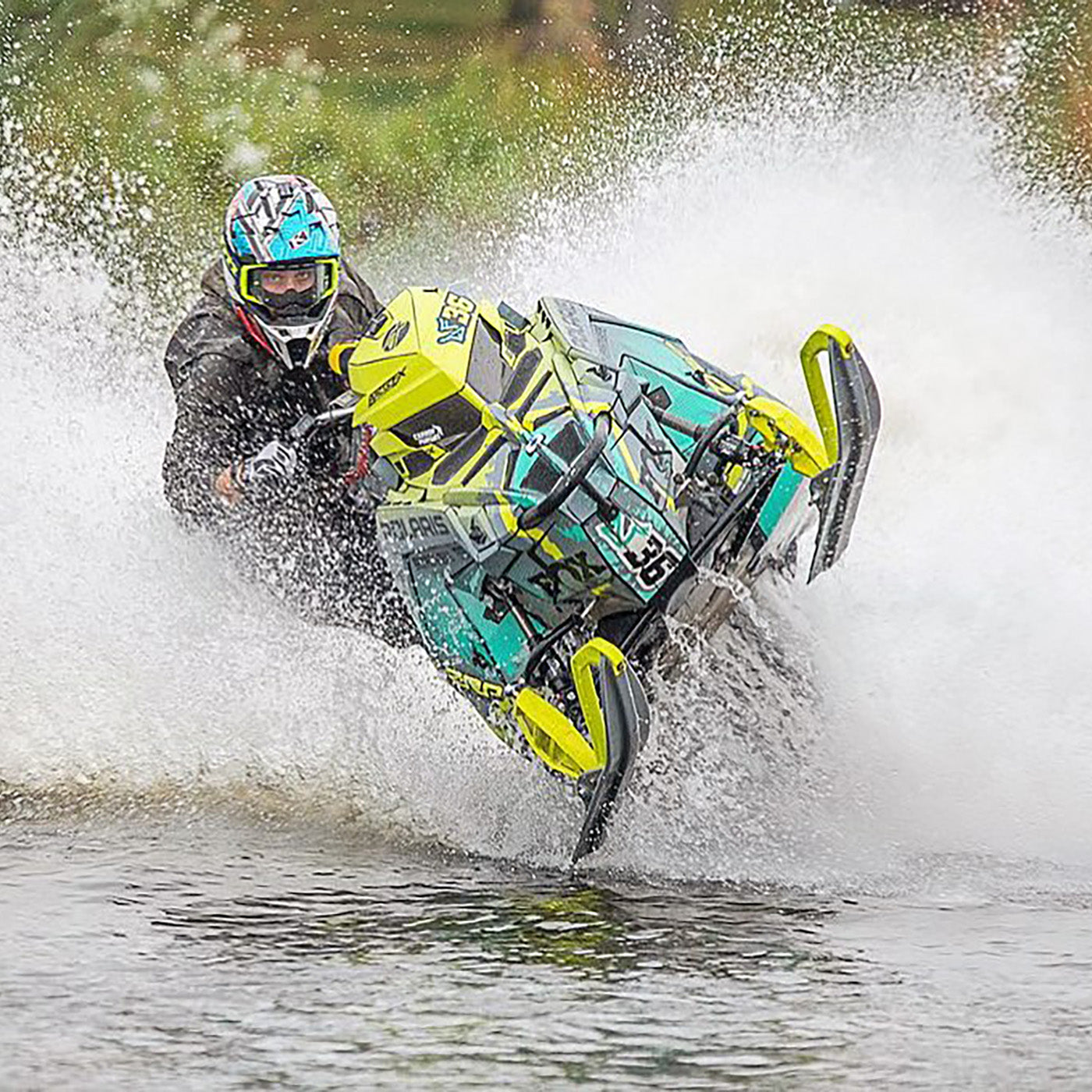 Watercross racer David Fischer racing on the water with black C&A Pro skis with yellow handles