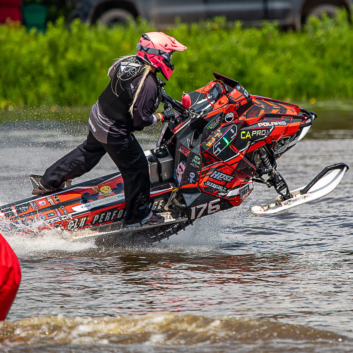 Krista Macki-Zurn racing on water with white C&A Pro skis with black handles
