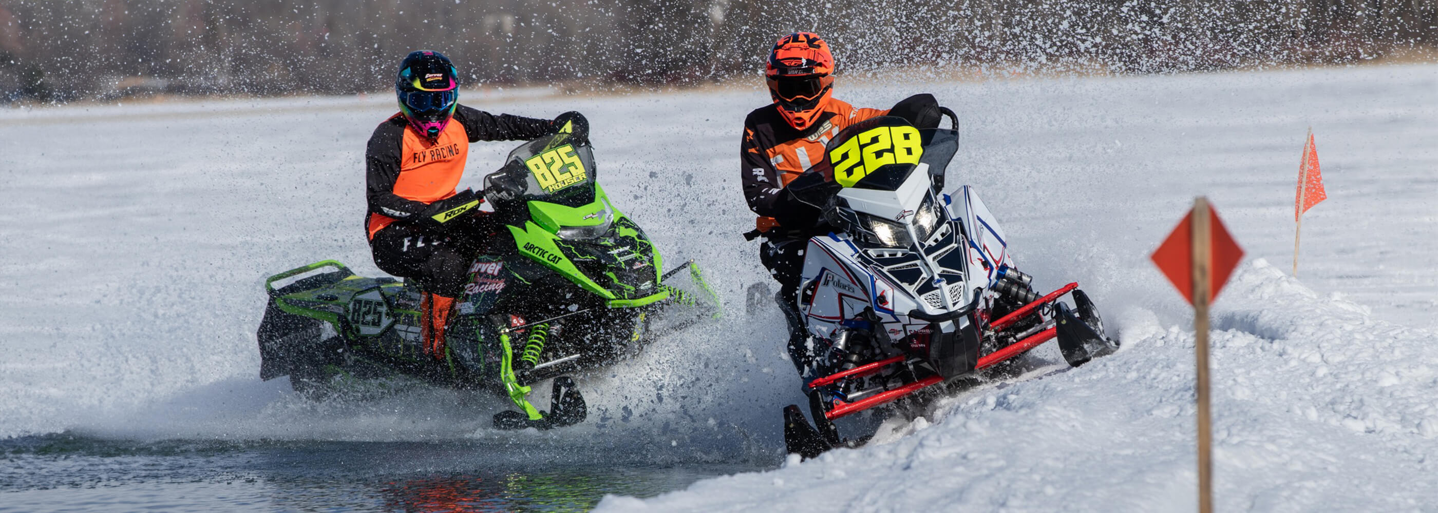 Two cross country snowmobile racers from Cor Powersports with C&A Pro skis