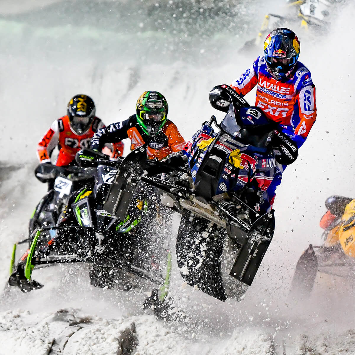 Group of professional Snocross athletes racing snowmobiles at ISOC Amsoil National Snocross