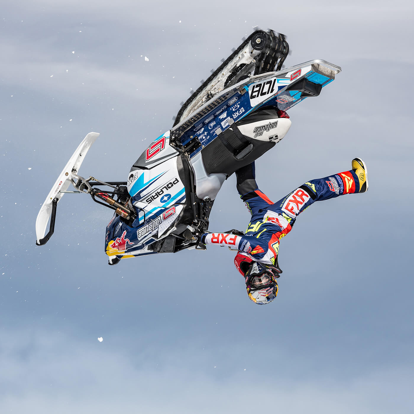 Levi LaVallee midair with white C&A Pro skis with black handles