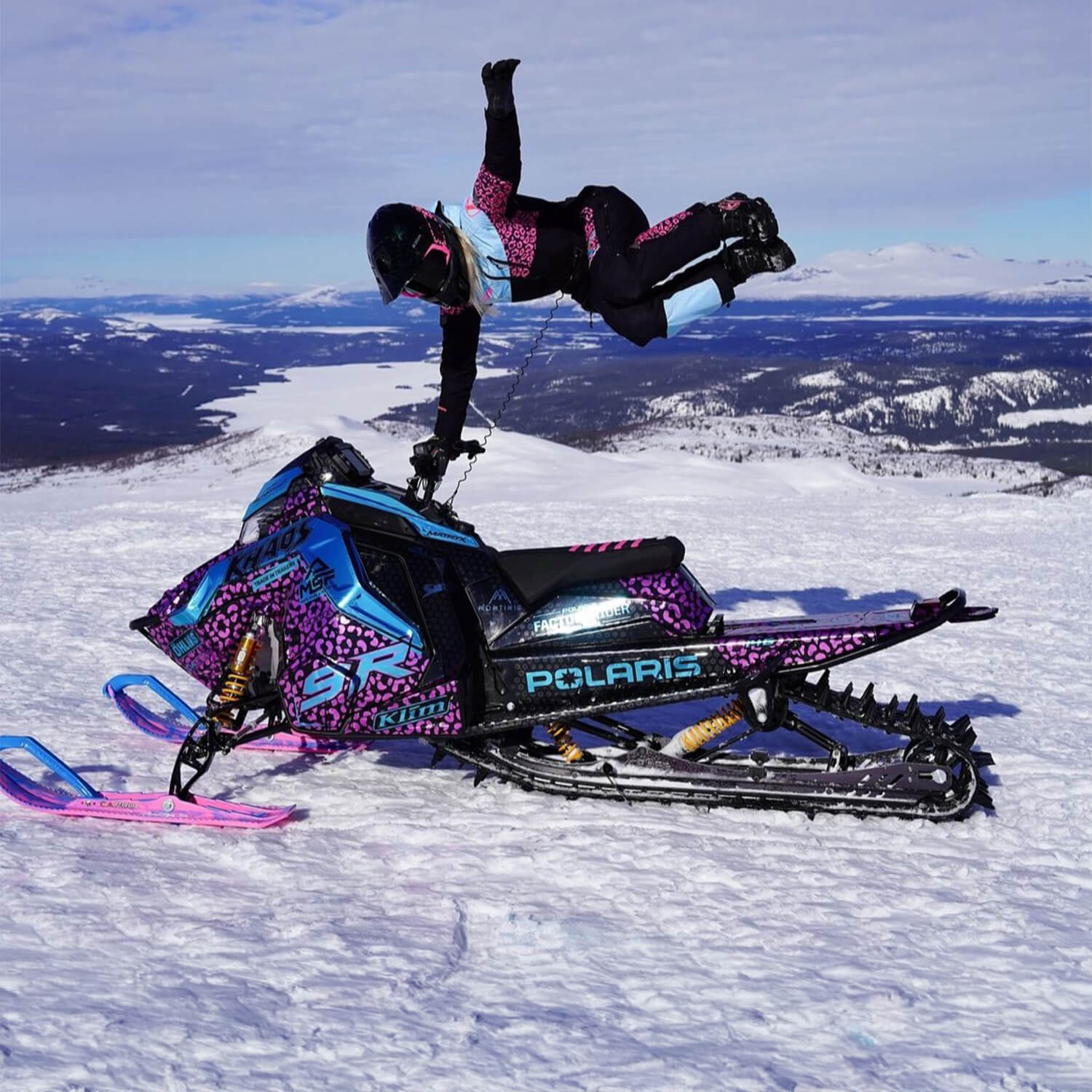 Professional backcountry snowmobile athlete Mikaela Gronlund from Sweden with pink and blue custom C&A Pro mountain skis
